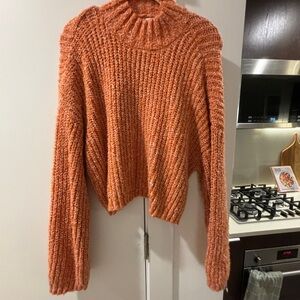 Orange mock neck sweater with bell sleeves
